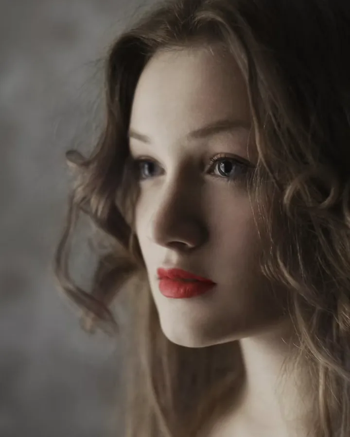 A woman with soft, freshly styled waves